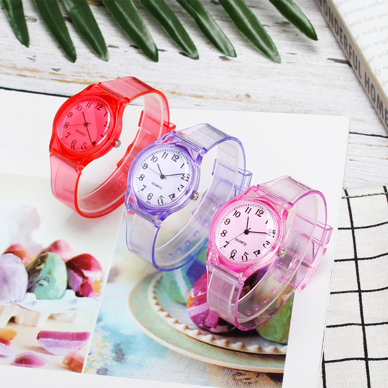 RELOJ QUARTZ TRANSPARENTE COLORES