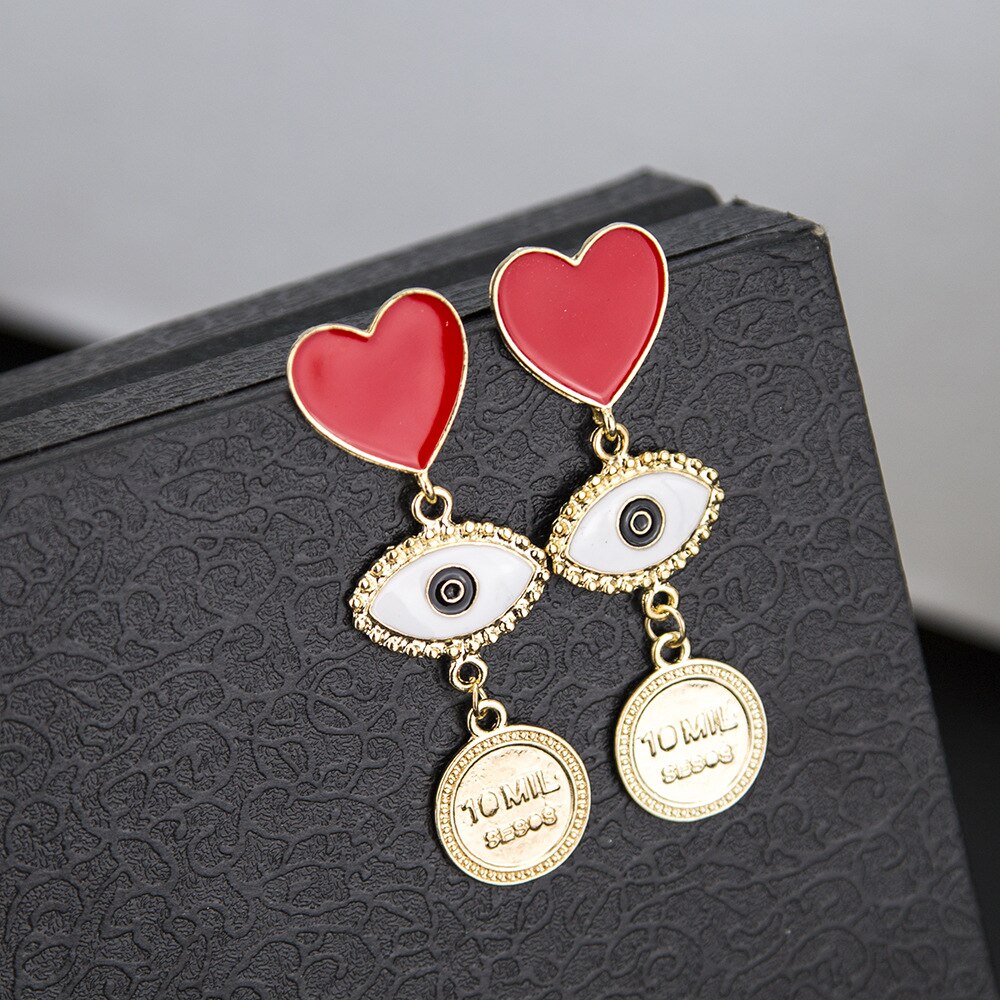 ARETES LARGOS CORAZON OJO TURCO